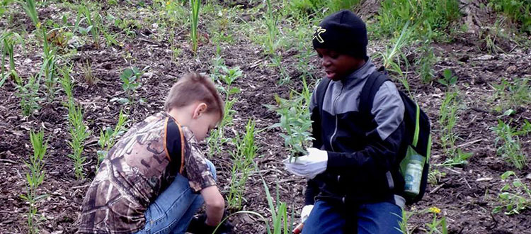 Kids planting for the sake of the Rouge River's restoration